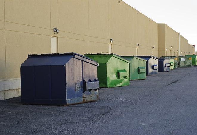 construction waste bins waiting to be picked up by a waste management company in Belfield